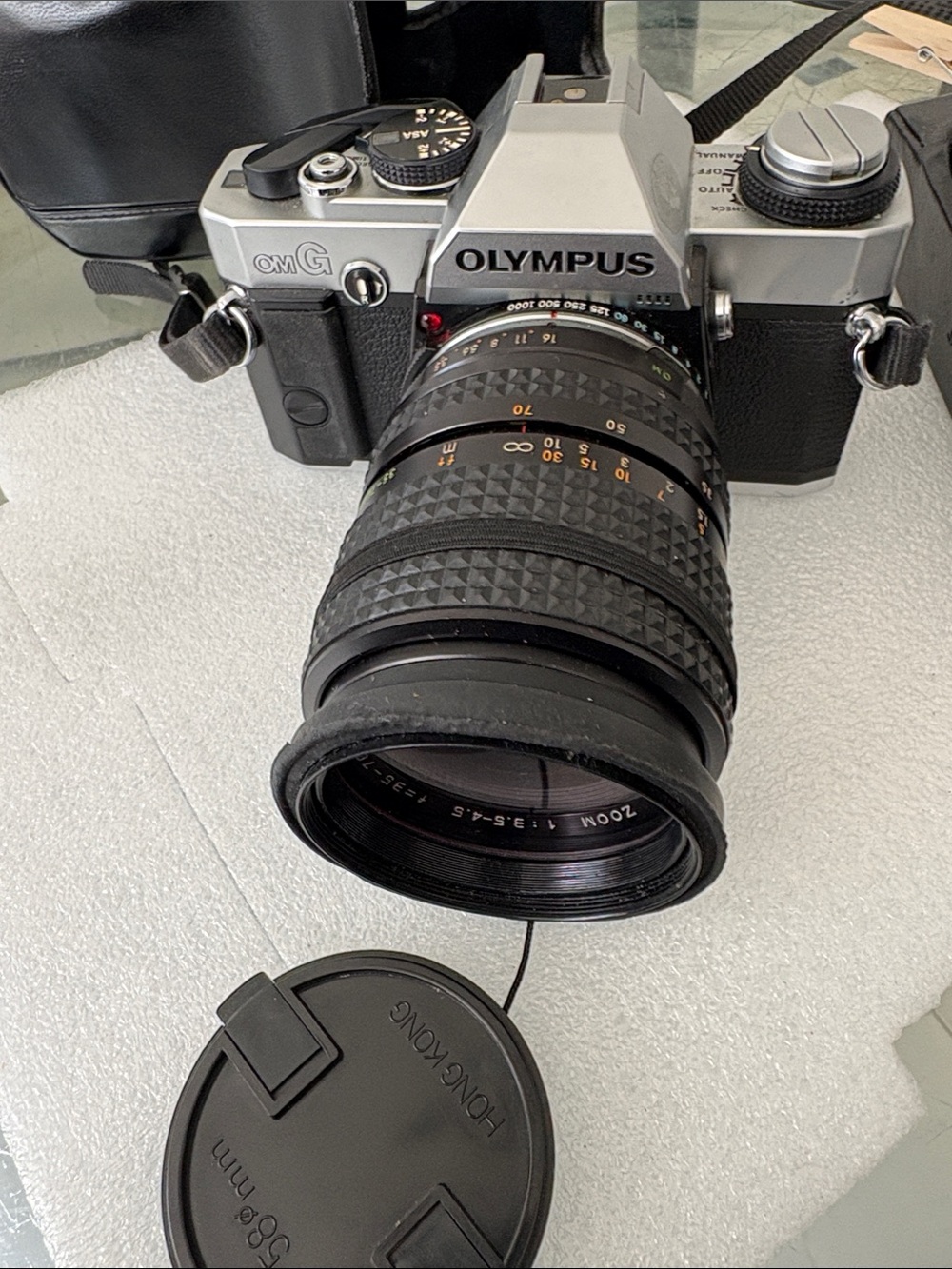 Olympus Silver and Black 35mm SLR Camera with Black Zoom Lens